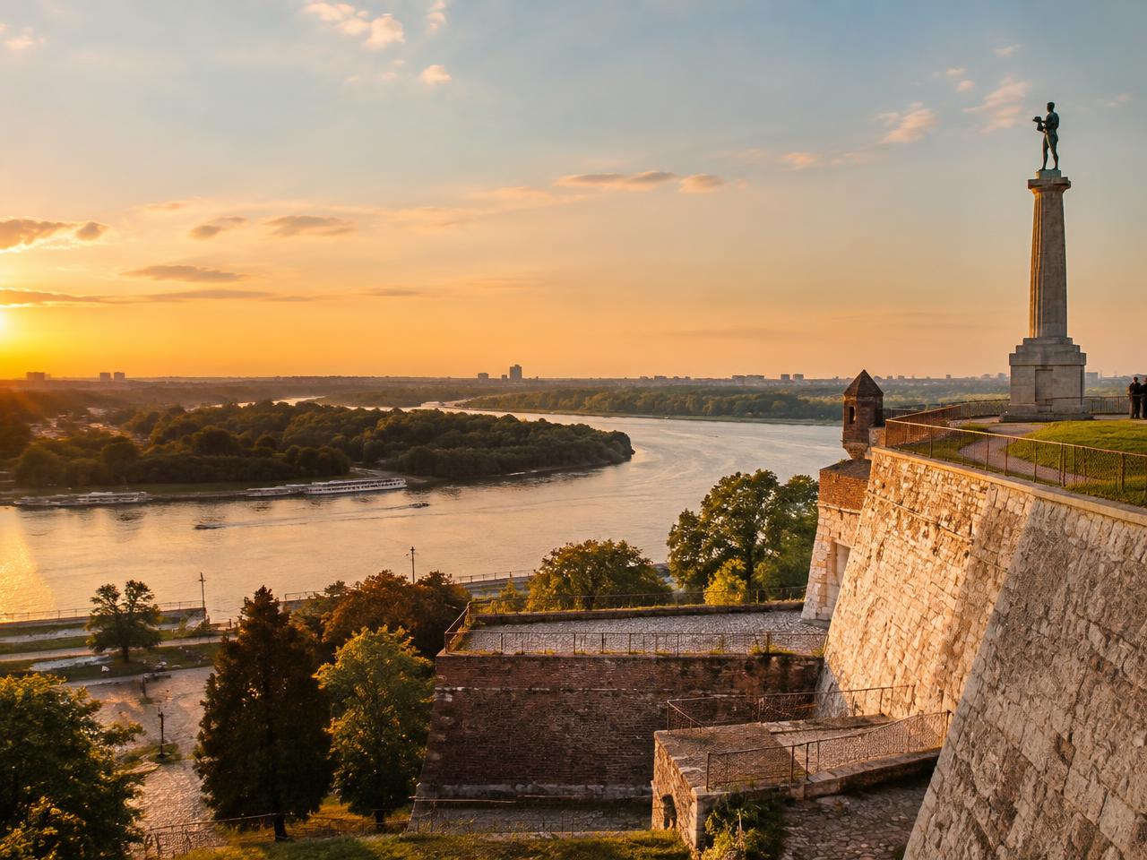 Belgrade fortress walls above the meeting of the Sava and Danube at sunset