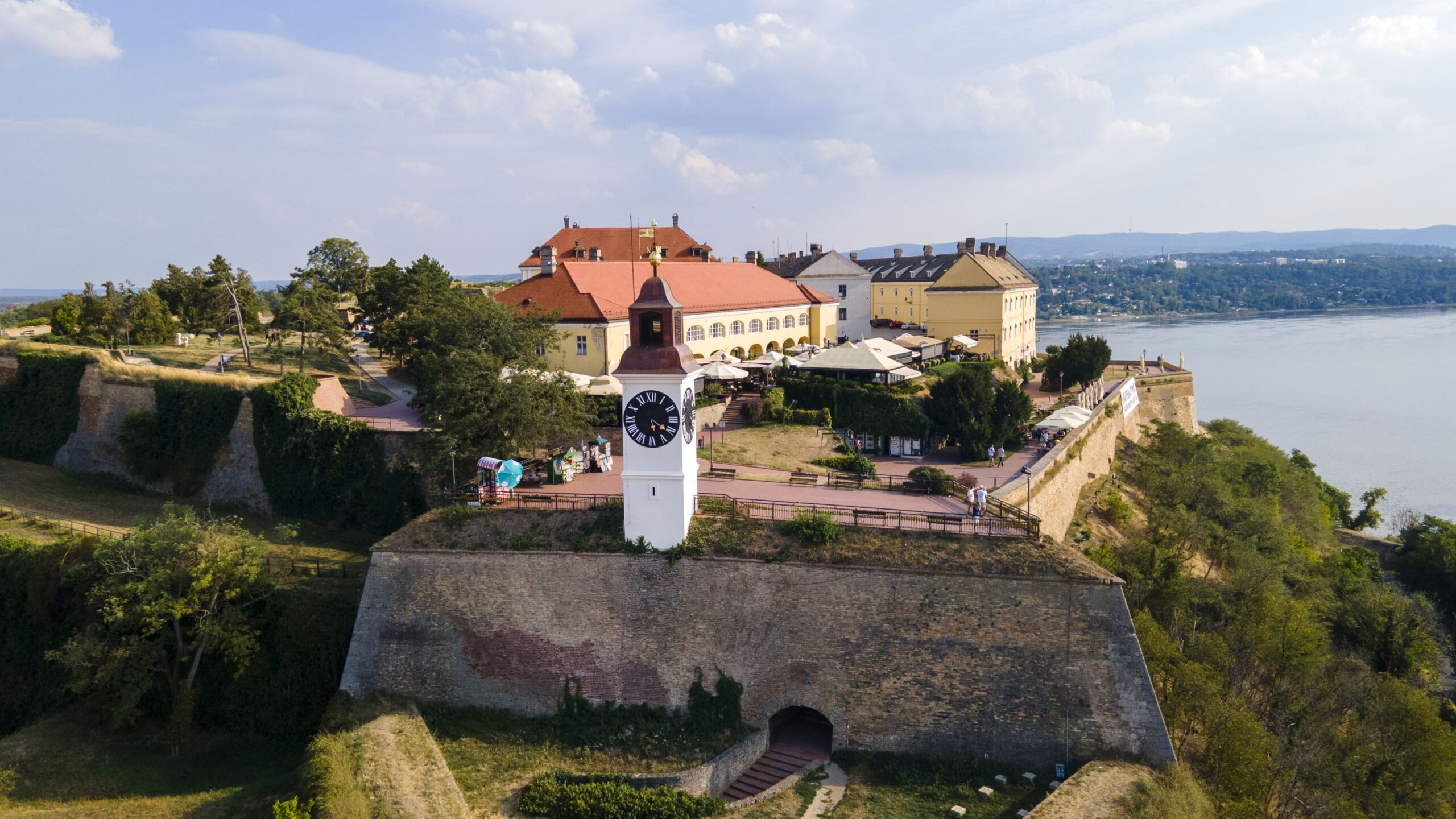 Aerial view of Petrovaradin Fortress and its clock tower above the Danube