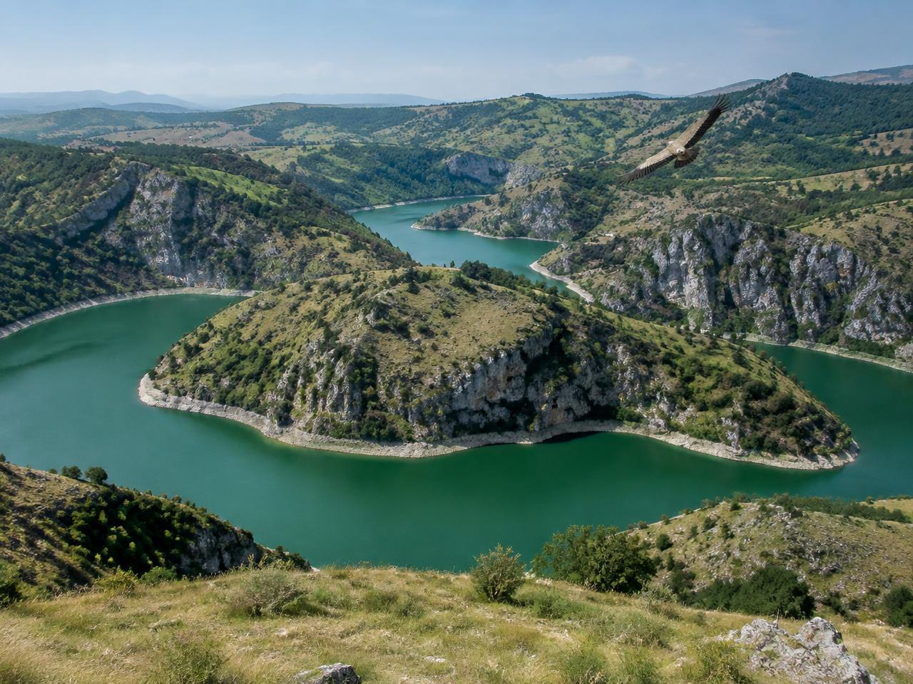 The emerald meanders of the Uvac river between limestone cliffs